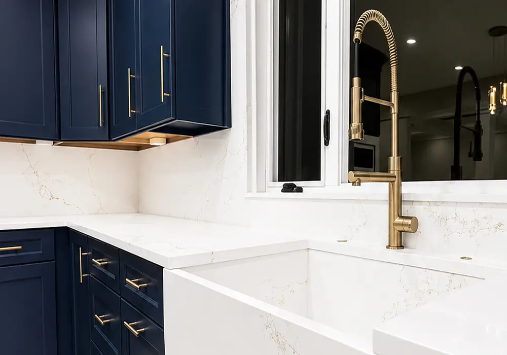 chic-kitchen-with-blue-furniture-and-golden-and-marble-details