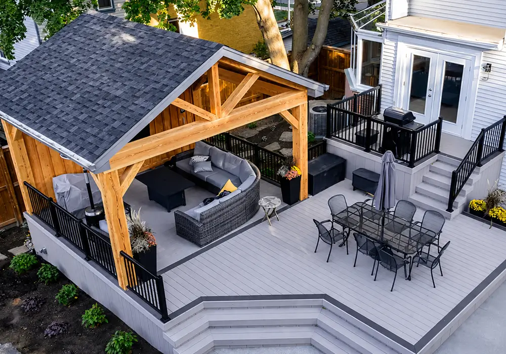 modern-gray-and-black-deck-featuring-an-outdoor-dining-area
